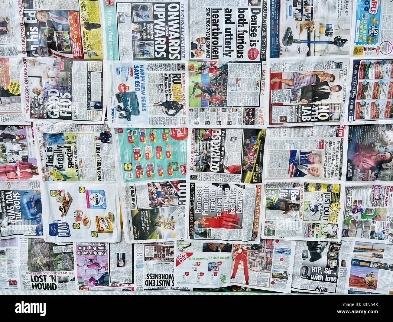 Shop window covered by newspaper - Smartphone Captured Stock Image