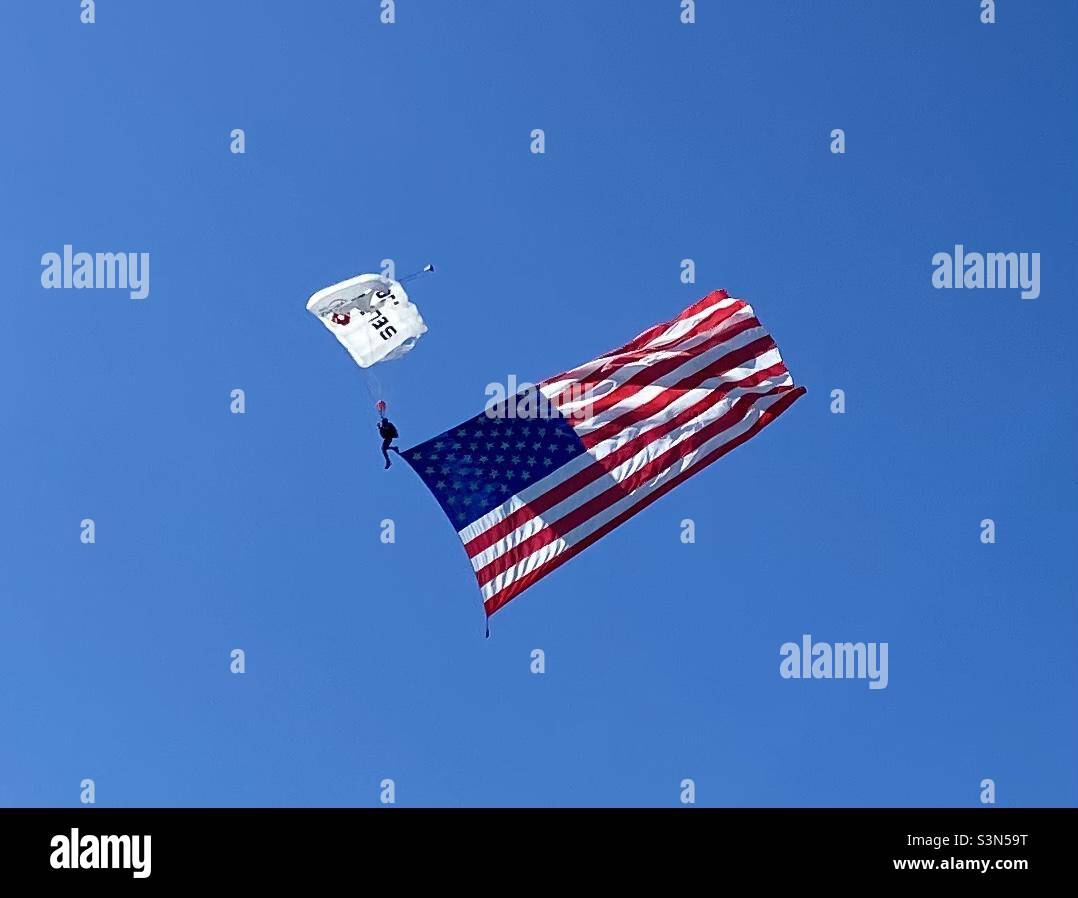Skydiver carrying the American Flag Stock Photo