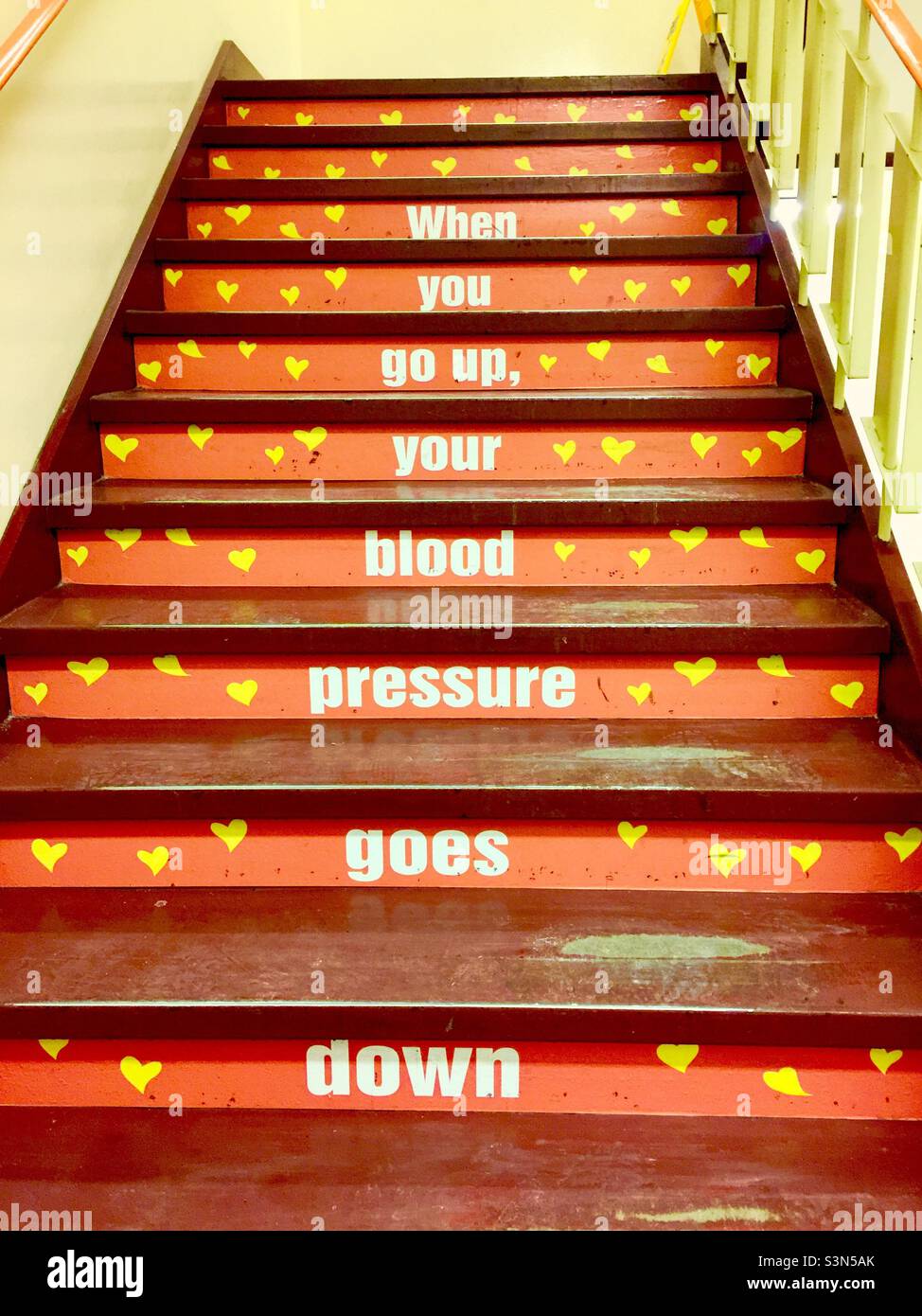 Messages on the steps. Take the stairs. Good for keeping blood pressure down, Ontario, Canada. Motivational. Health benefits. Walking. Stock Photo