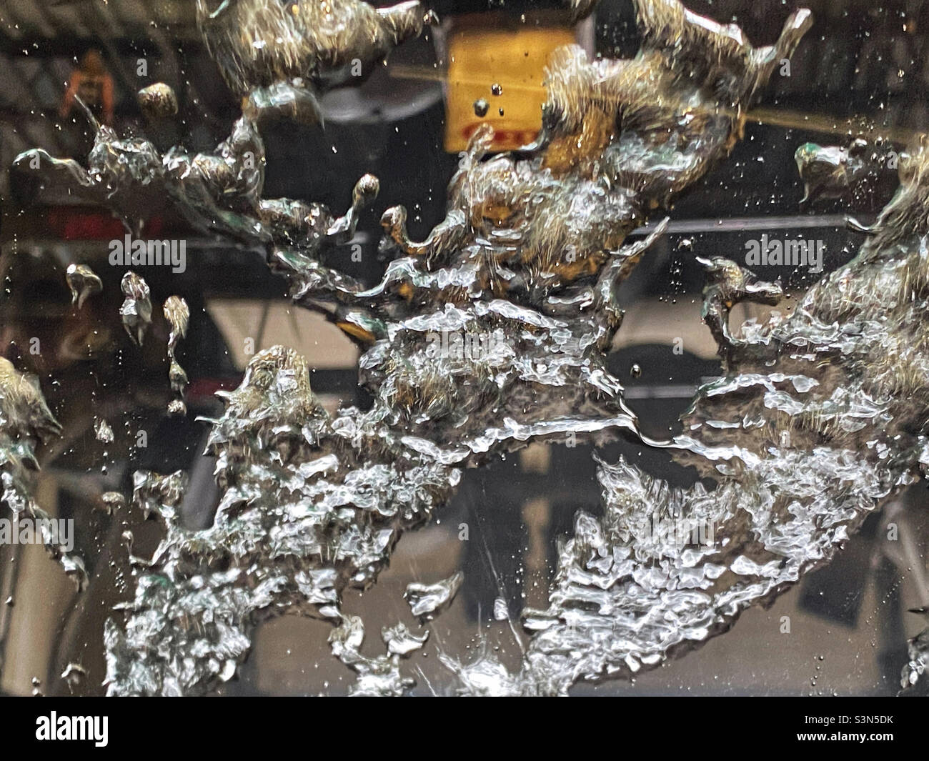 Water being blown off a windshield in a car wash - Smartphone Captured Stock Image