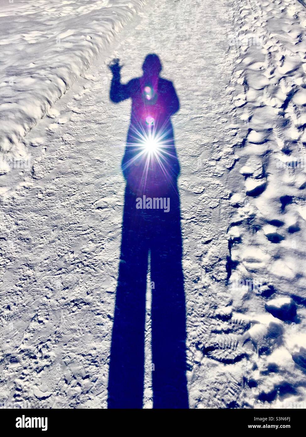 Selfie in snow. The light within. The inner spark. Cold outside. Hi, hello there. Energy flows. From darkness unto light. Lead kindly light. Wisdom of the universe. - Smartphone Captured Stock Image