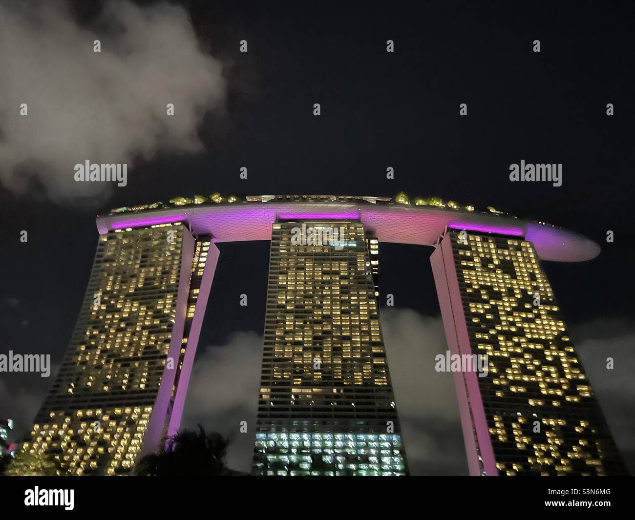 Singapore Marina Bay Sands hotel lit up against night skies Stock Photo