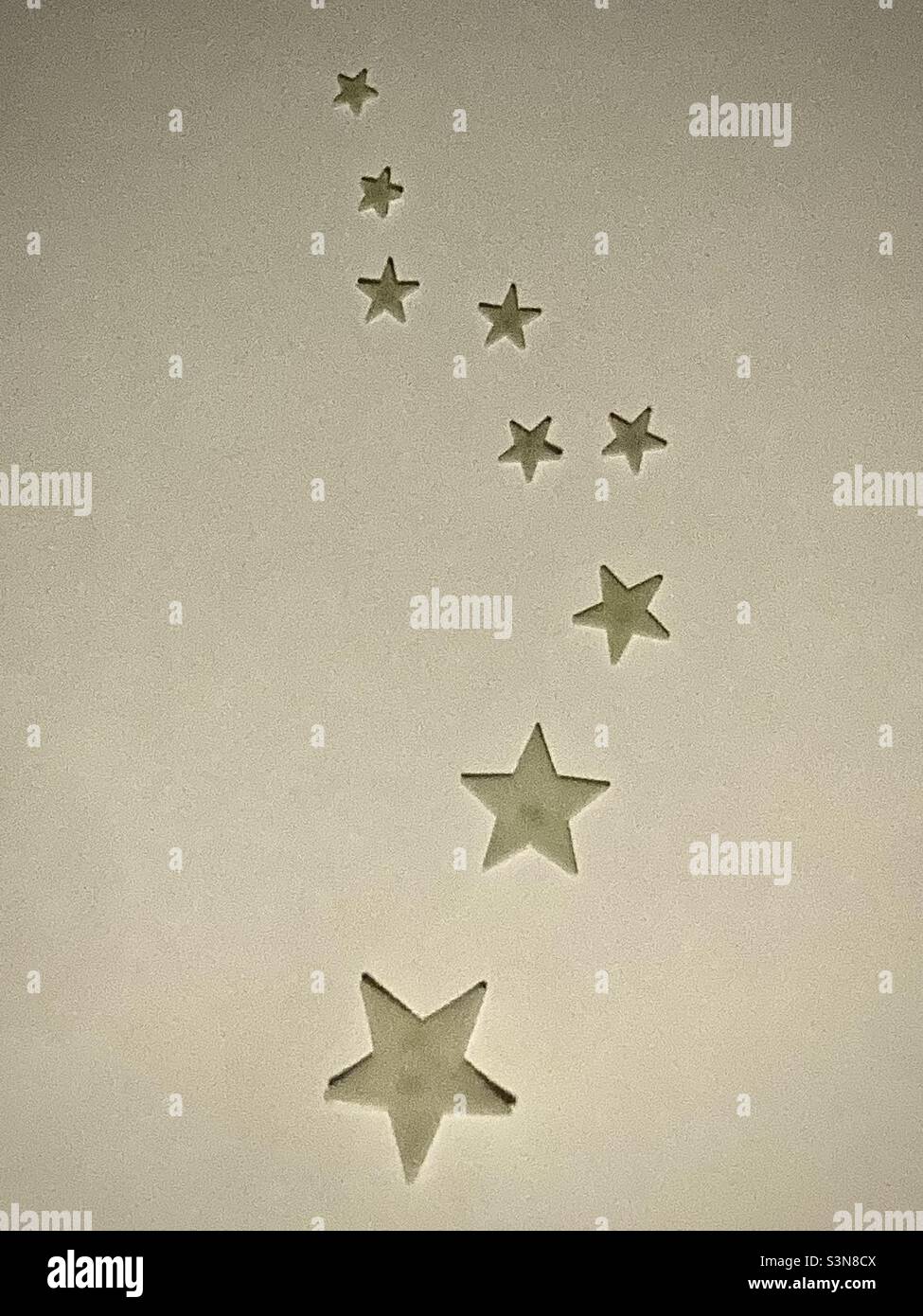 Photo of plastic luminous stars on a white ceiling in a children's bedroom - Smartphone Captured Stock Image
