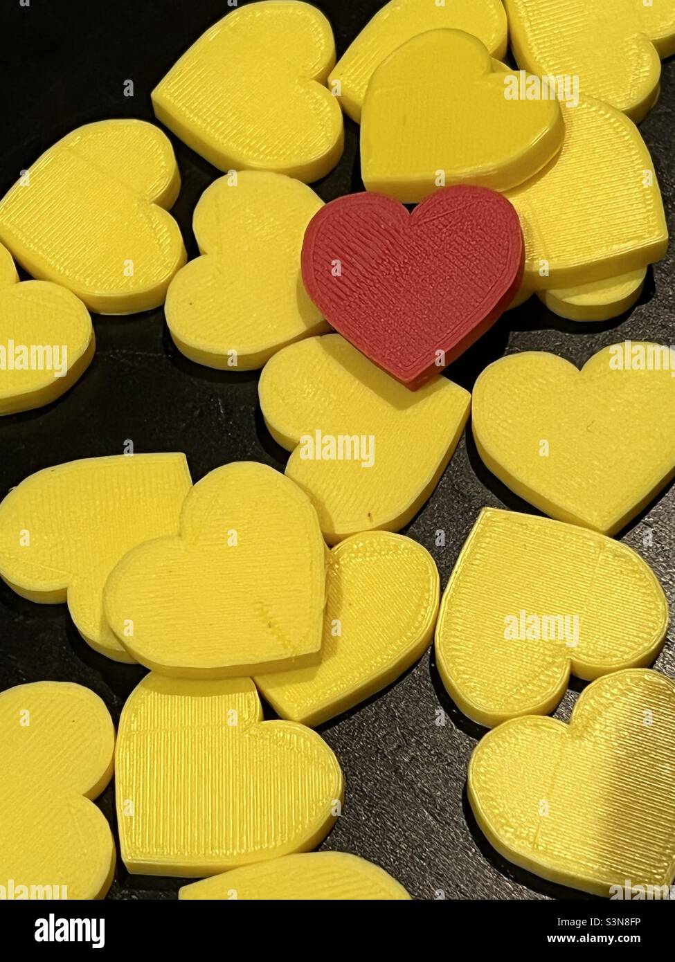 Stack of 3D printed valentine hearts Stock Photo