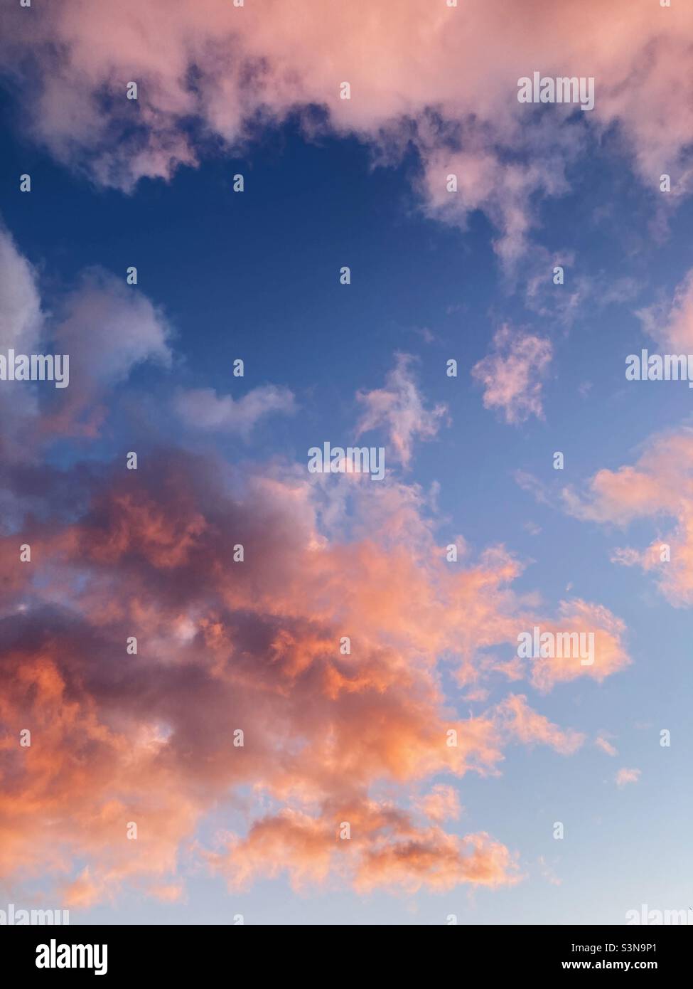 Pink clouds in a blue sky - Smartphone Captured Stock Image