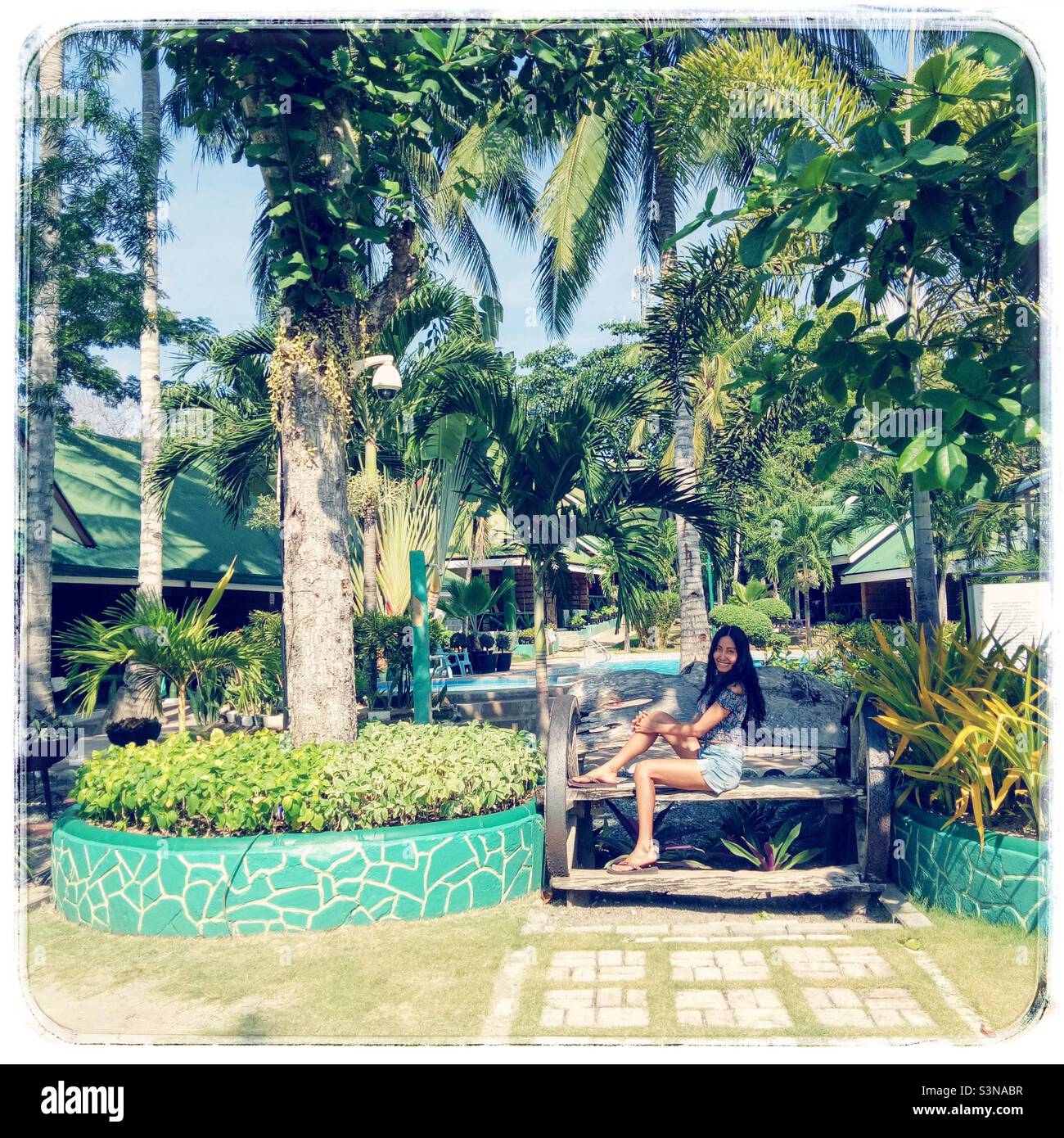 Cropped photo. Woman who sat on a bench - Smartphone Captured Stock Image