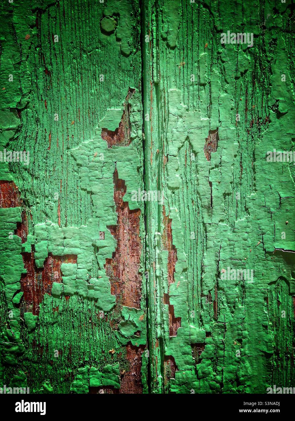 Flaking paint on wooden fence. Nyons, France. Stock Photo