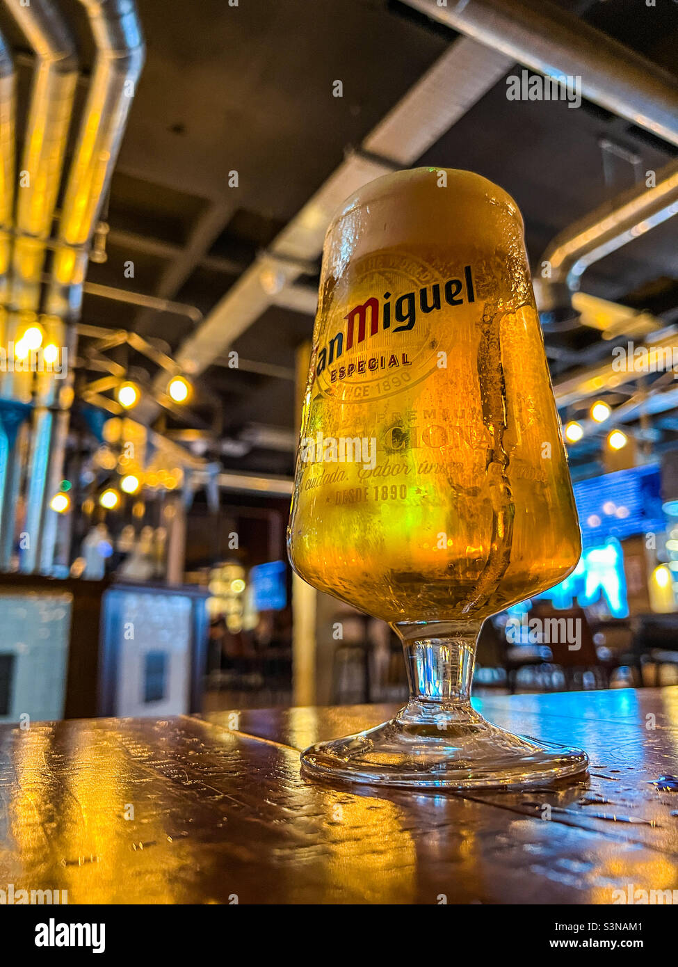 Pint of refreshing San Miguel lager in a trendy bar - Smartphone Captured Stock Image