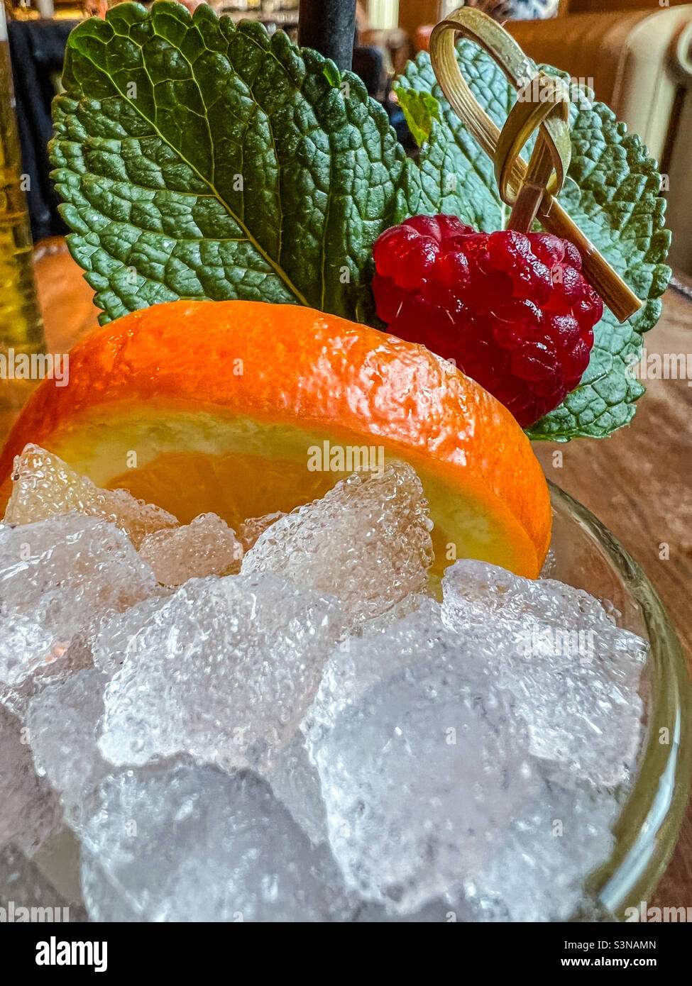 Ice and orange slice in cocktail - Smartphone Captured Stock Image