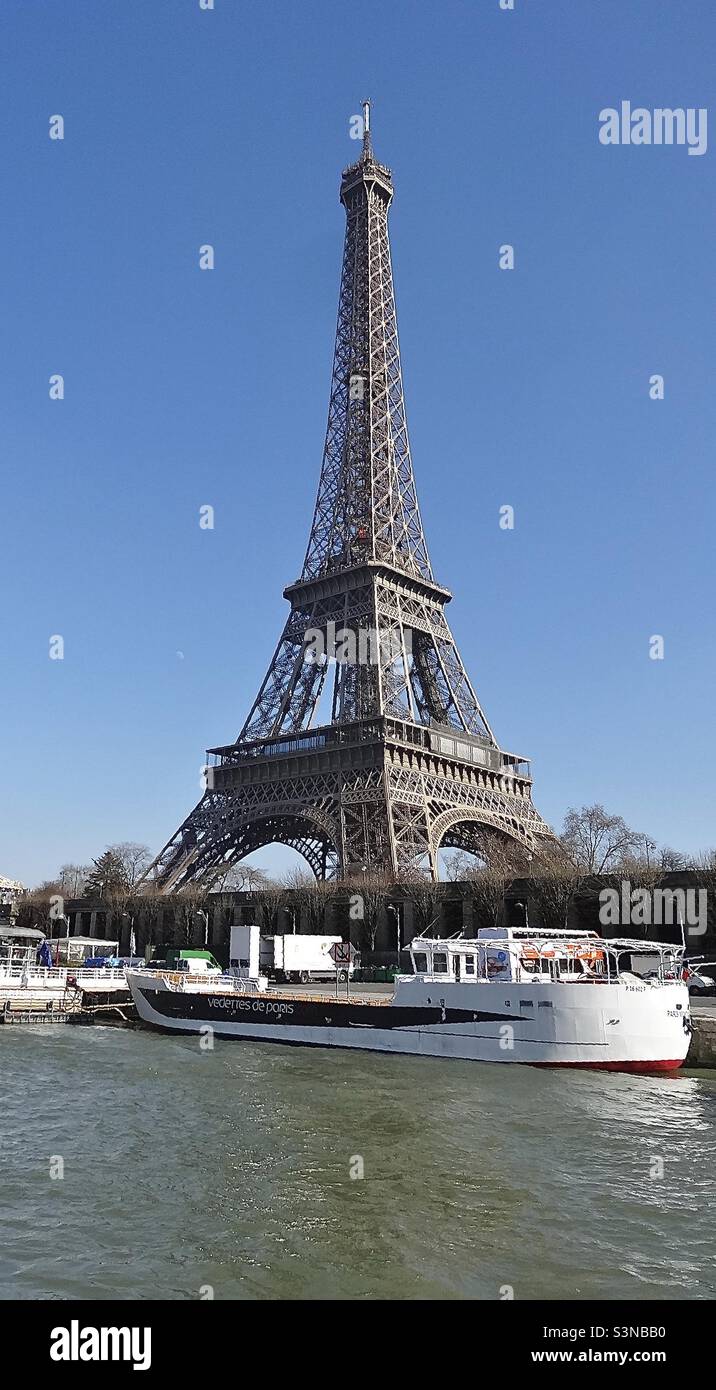 The Eiffel Tower, Paris, France, seen from the River Seine near the Pont d’lena. Opened on the 31st March 1889, originally as the centrepiece of the World’s Fair, it is an international global icon. Stock Photo