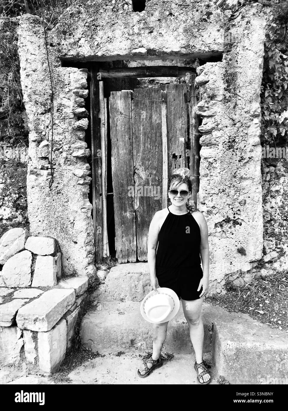 Stopping by an old door frame on our hike to paper mill ruins in La Valle delle Ferriere. - Smartphone Captured Stock Image