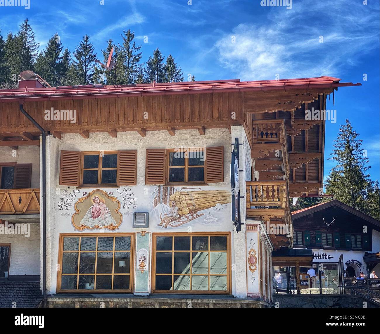 Traditional Bavarian house with facade paintings near lake Spitzingsee in Germany. - Smartphone Captured Stock Image