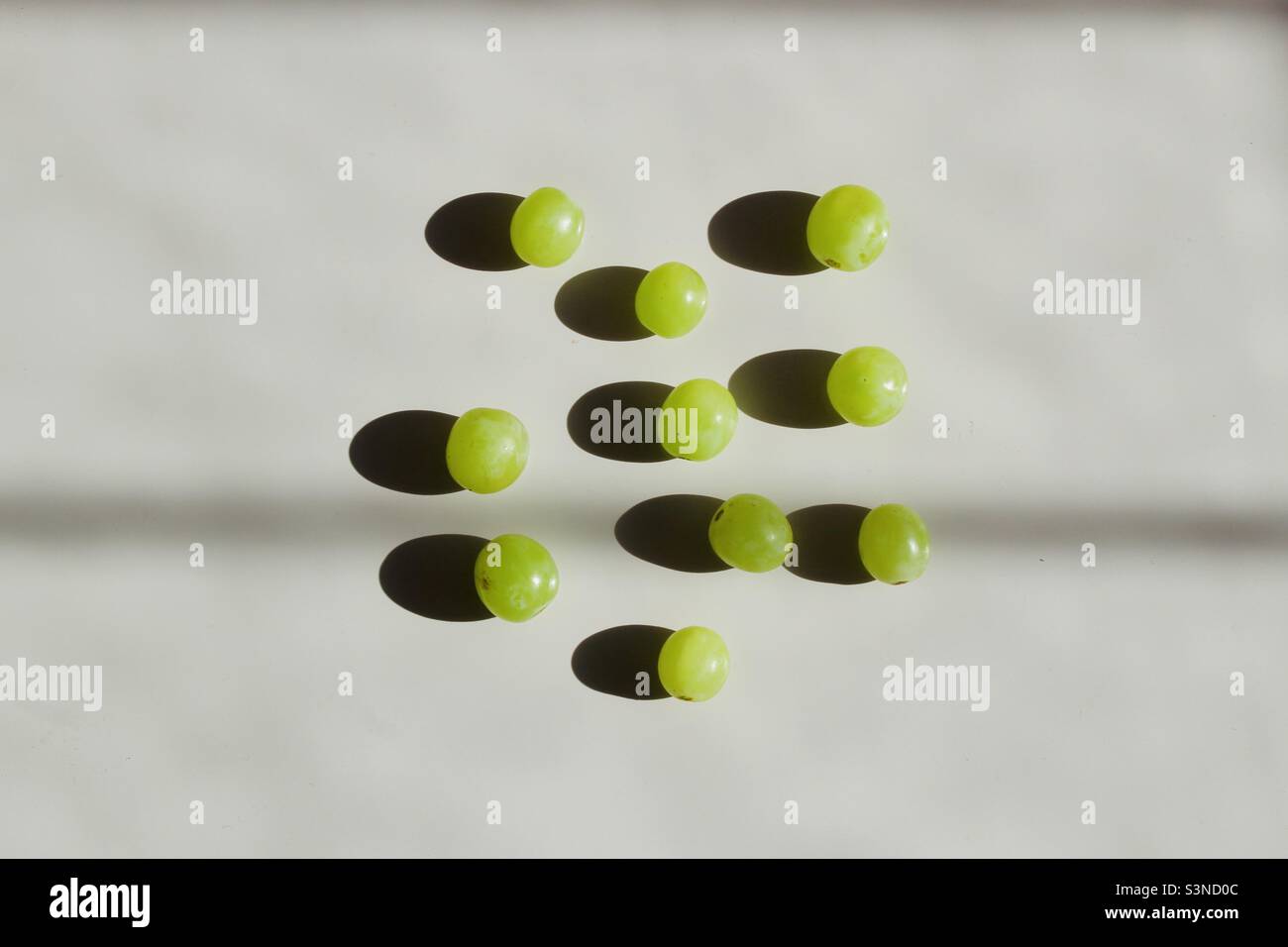 Green grapes on the white background Stock Photo