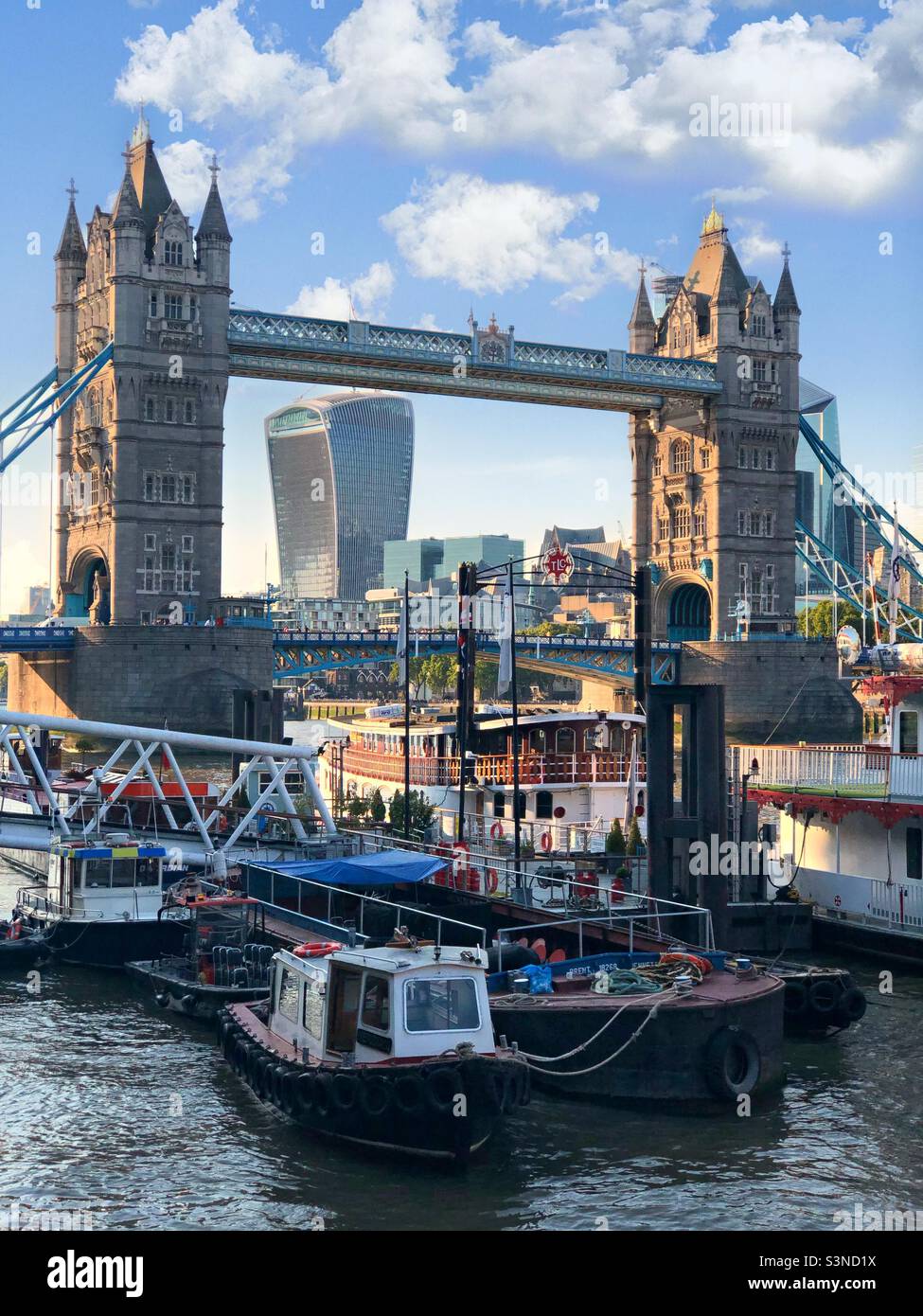 View of the Thames River in London with The Walkie Talkie and Tower Bridge in the background on a sunny morning - Smartphone Captured Stock Image
