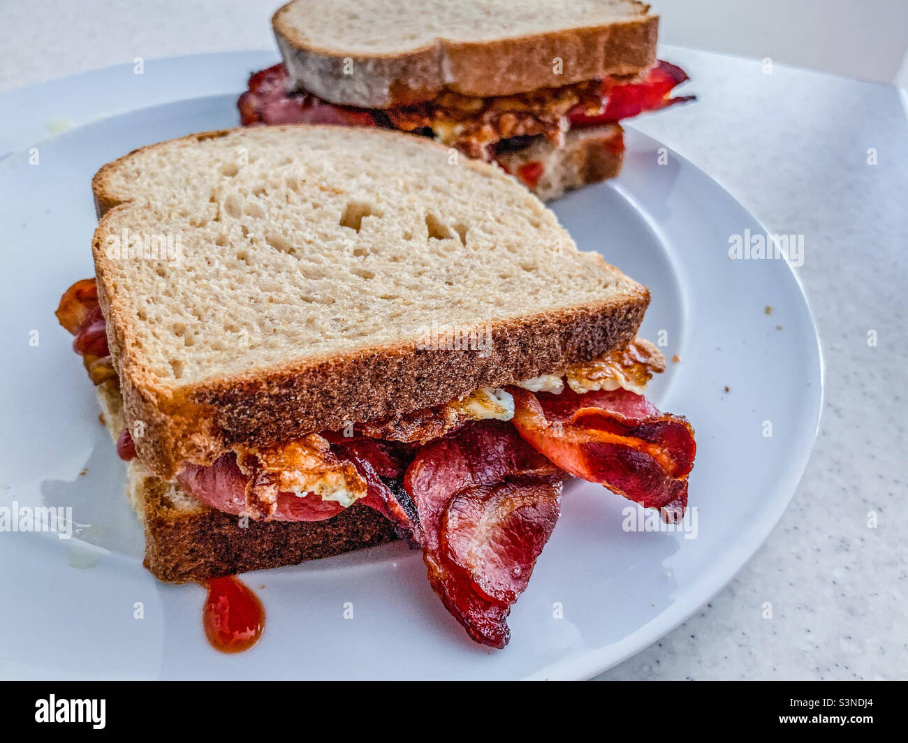 Bacon and egg sandwich on Wholemeal bread Stock Photo