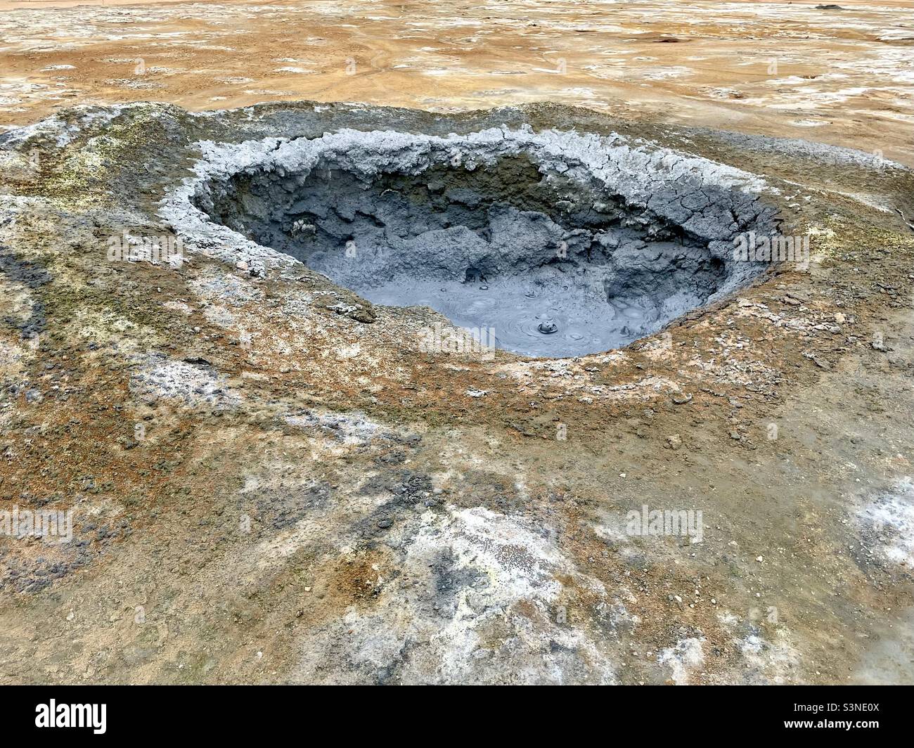 Big bubbling mud pot at Námaskard geothermal area in Iceland Stock Photo