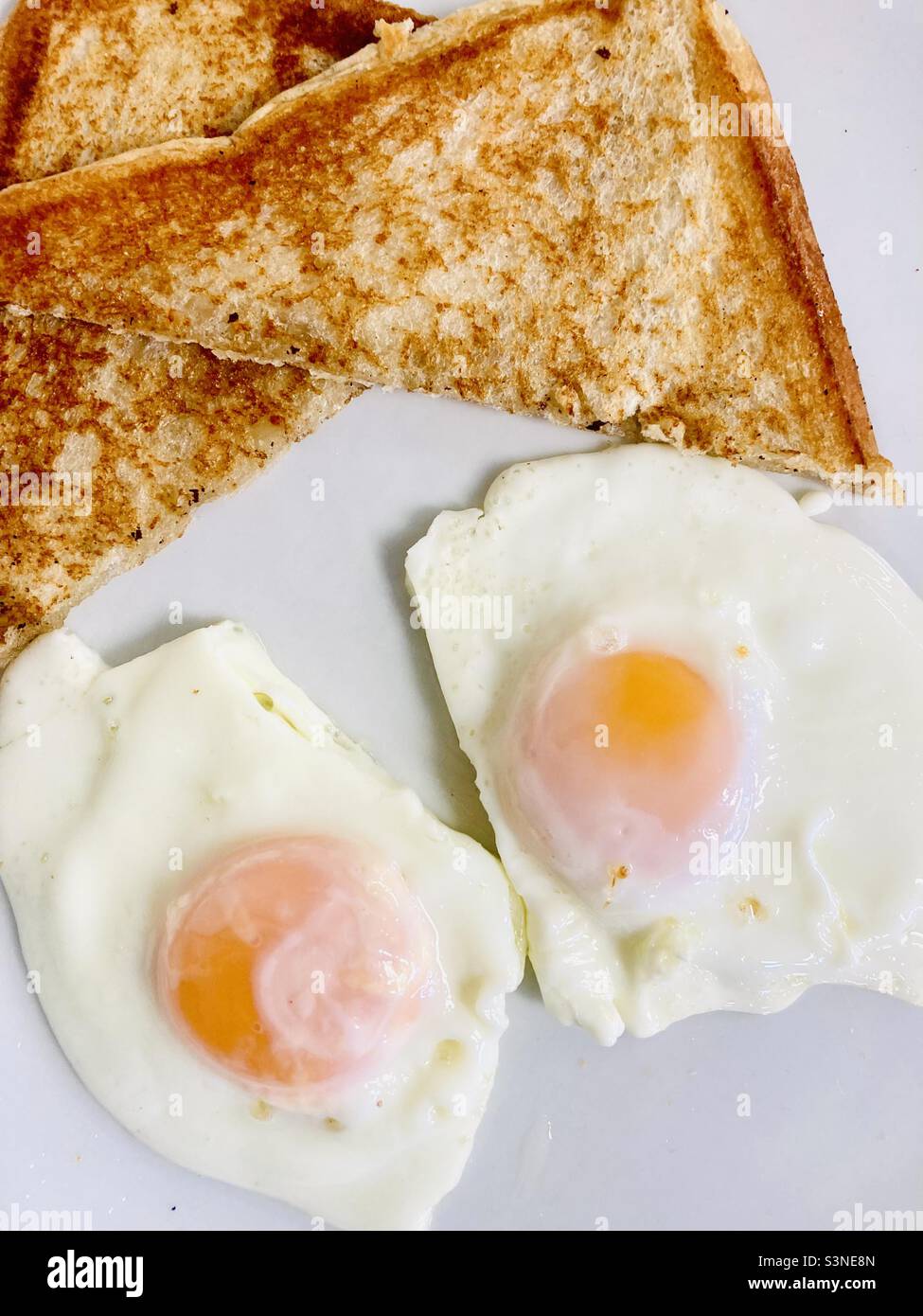 Fried bread and fried egg breakfast Stock Photo - Alamy