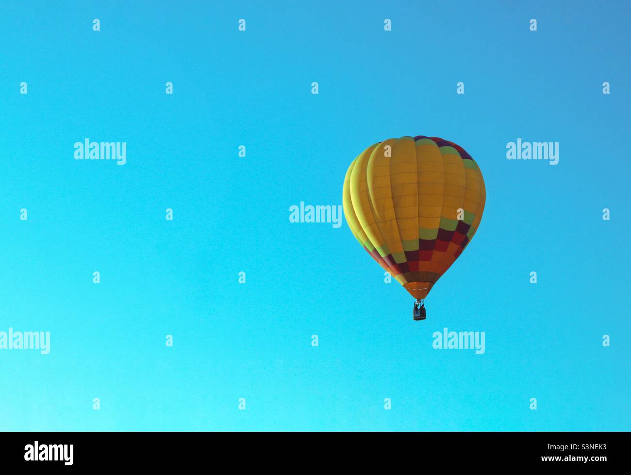 Colorful hot air balloon on the blue background - Smartphone Captured Stock Image