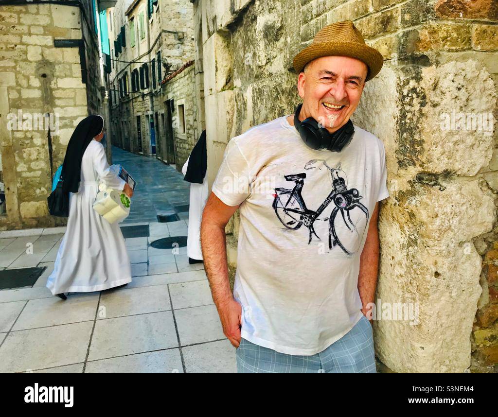 Croatian DJ Music Selector posing with nuns - Smartphone Captured Stock Image