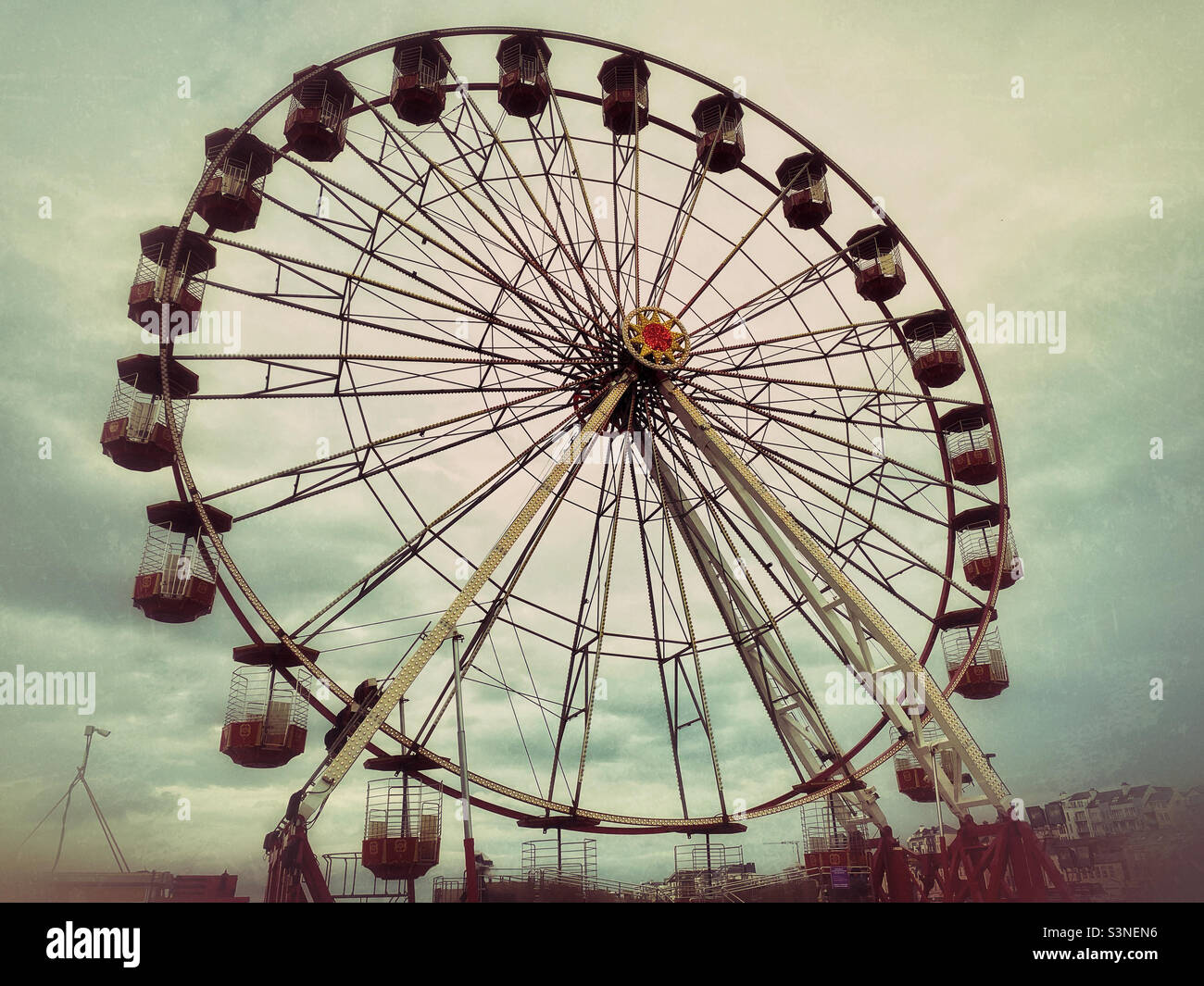 A large Ferris Wheel - awaiting riders to sit in the individual pods. Photo ©️ COLIN HOSKINS. - Smartphone Captured Stock Image