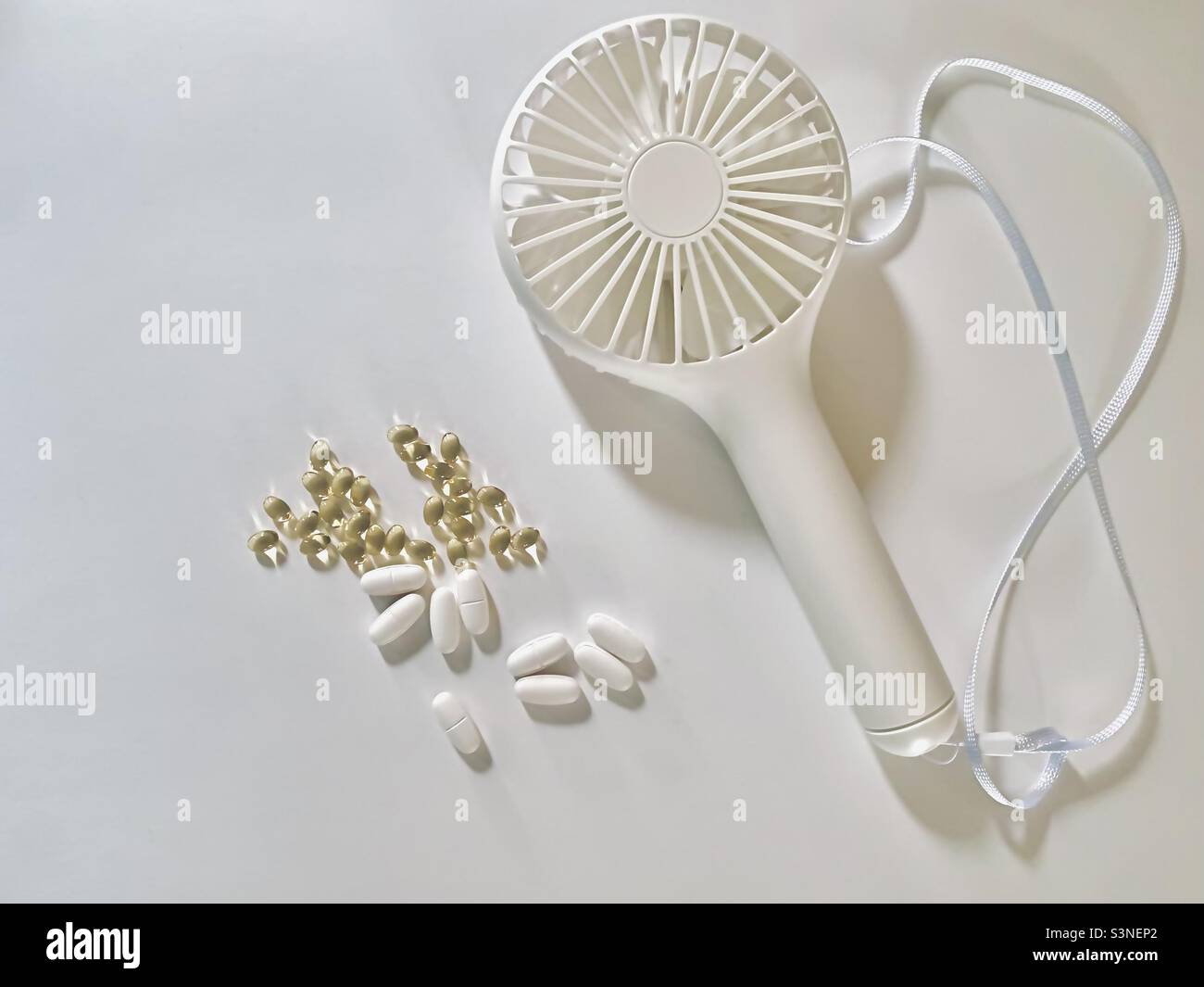 Minimalistic women’s health and menopause flat lay featuring a portable