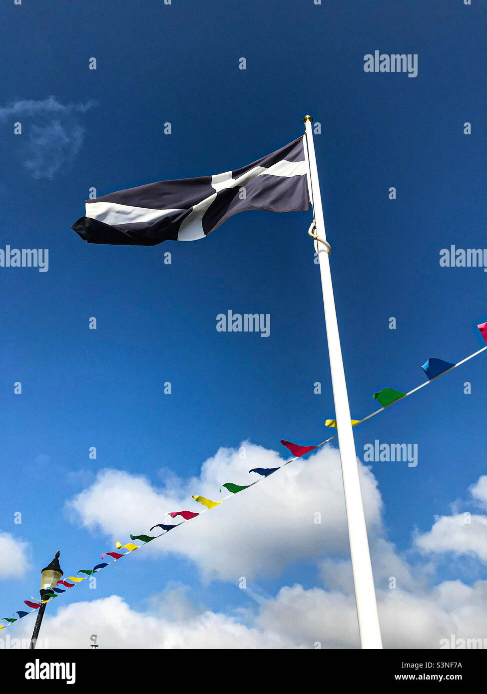 Cornish flag on pole Stock Photo