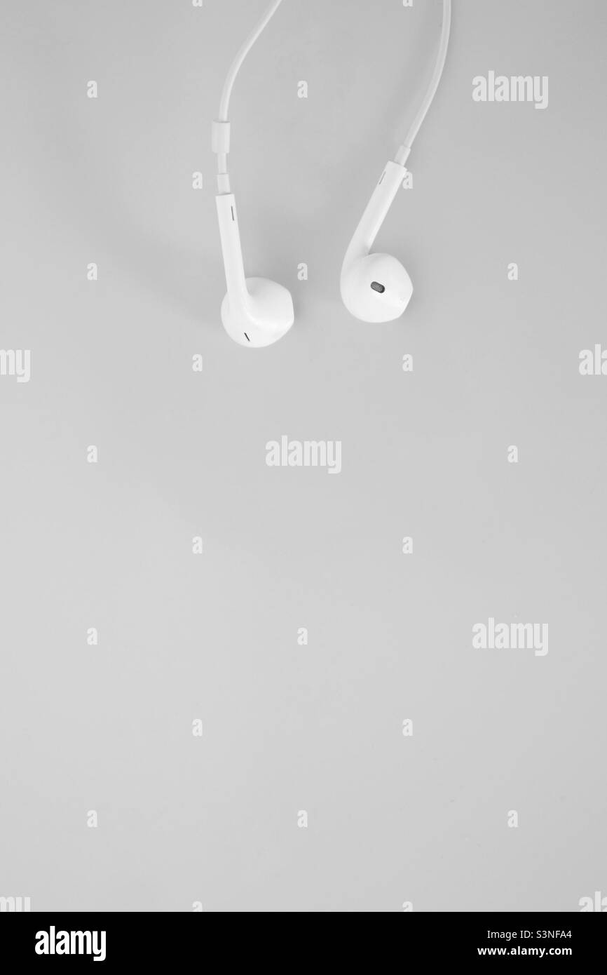 White headphones on the white background - Smartphone Captured Stock Image