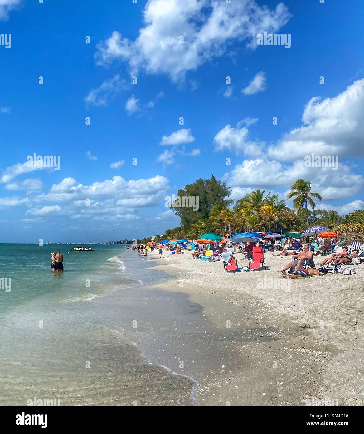 Beach goers in Fort Myers Florida. Stock Photo
