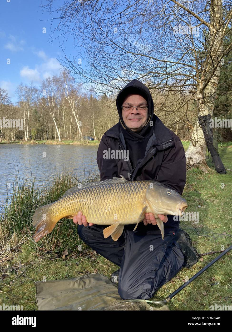 Common carp caught on sunny winter day - Smartphone Captured Stock Image