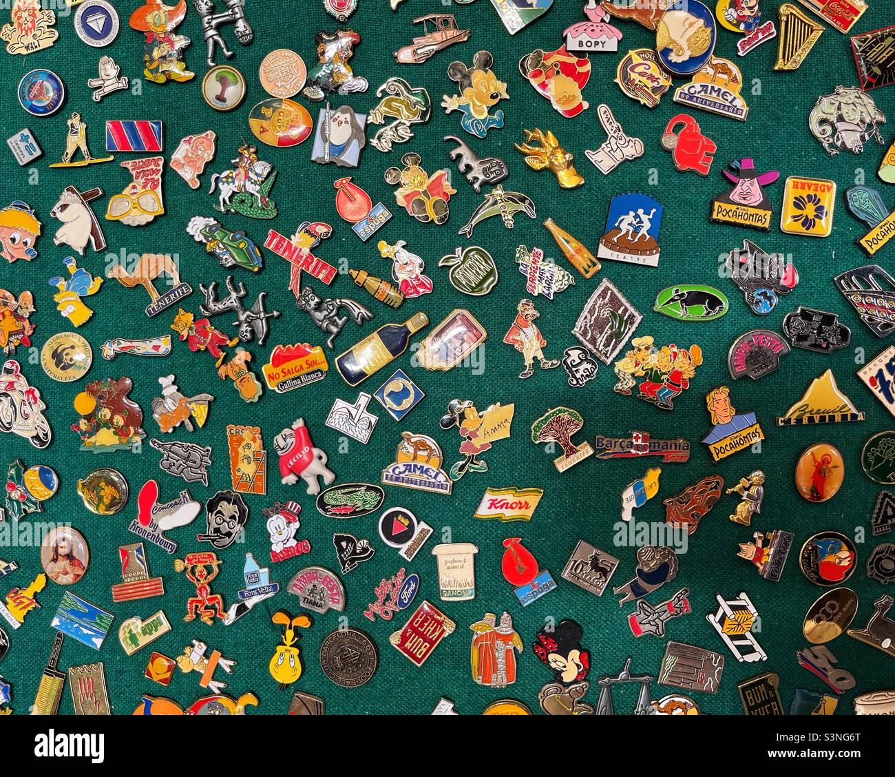 Vintage enamel pins on green background at flea market Stock Photo Alamy