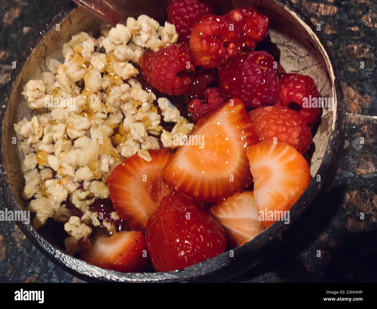 Açaí fruit bowl, Fruit bowl with granola, strawberries and raspberries Stock Photo