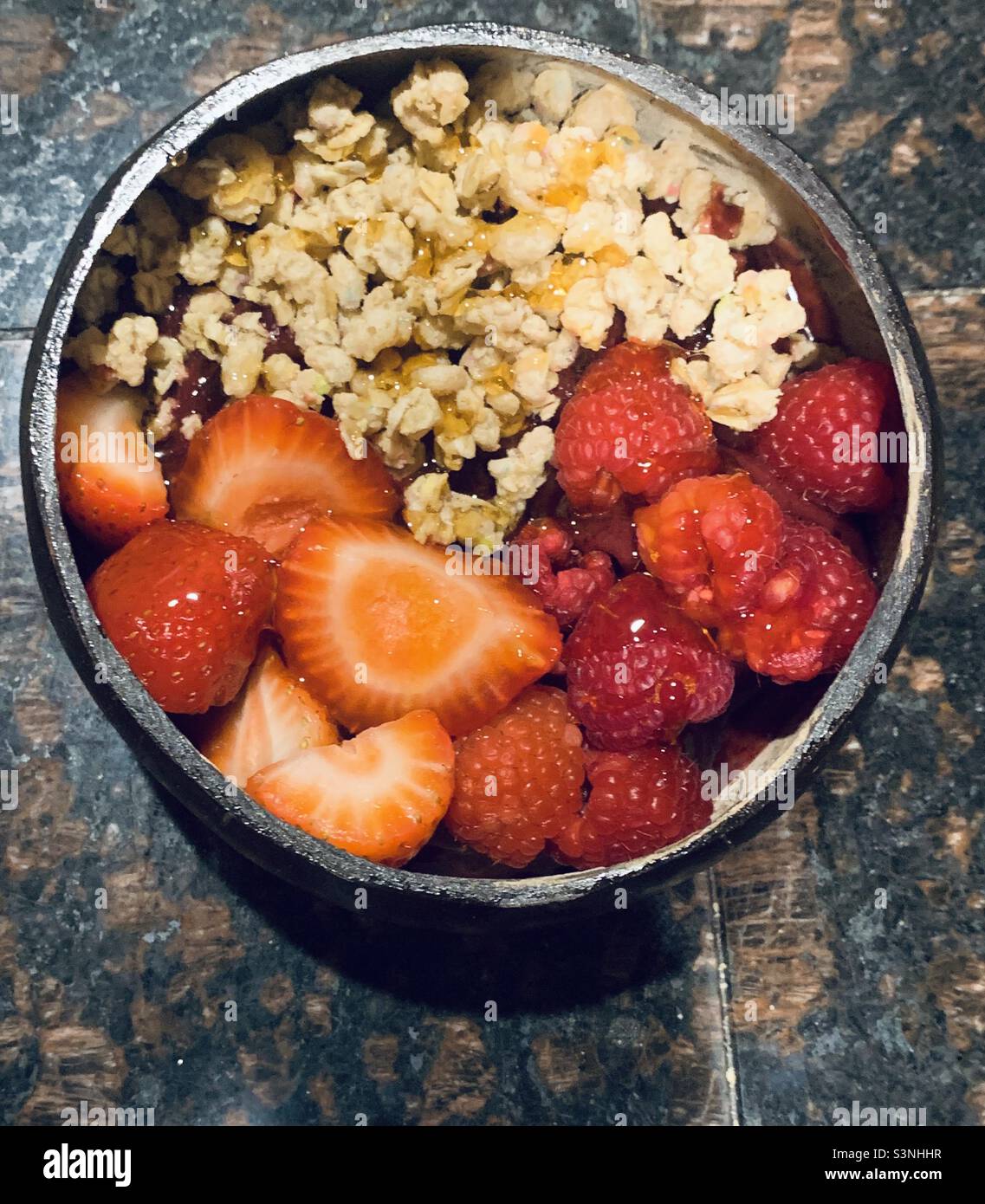 Fruit bowl with strawberries , raspberries and granola- açaí fruit bowl Stock Photo
