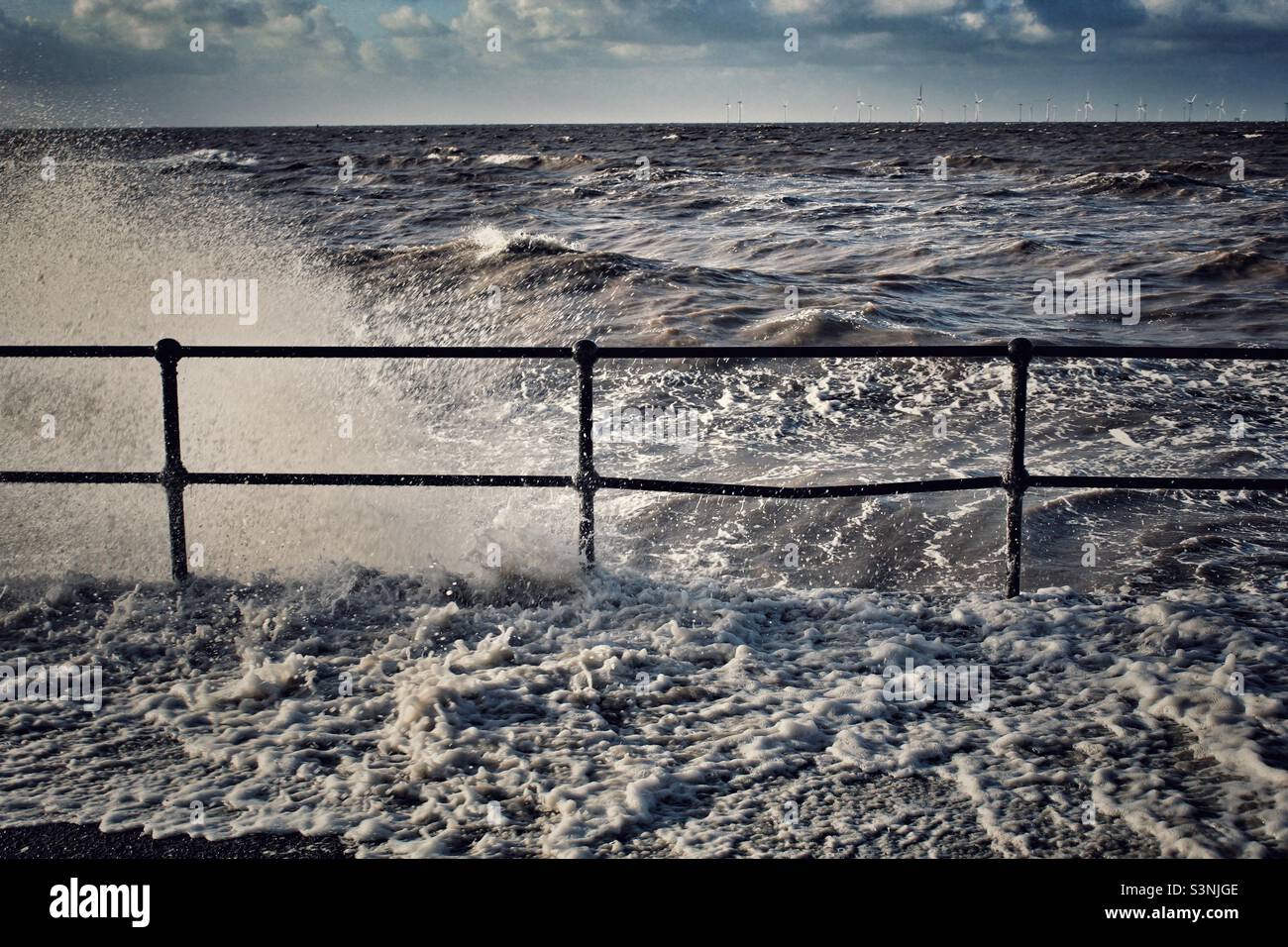 Sea crashing against the coast during Storm Eunice at Crosby Beach in Liverpool, Merseyside - Smartphone Captured Stock Image