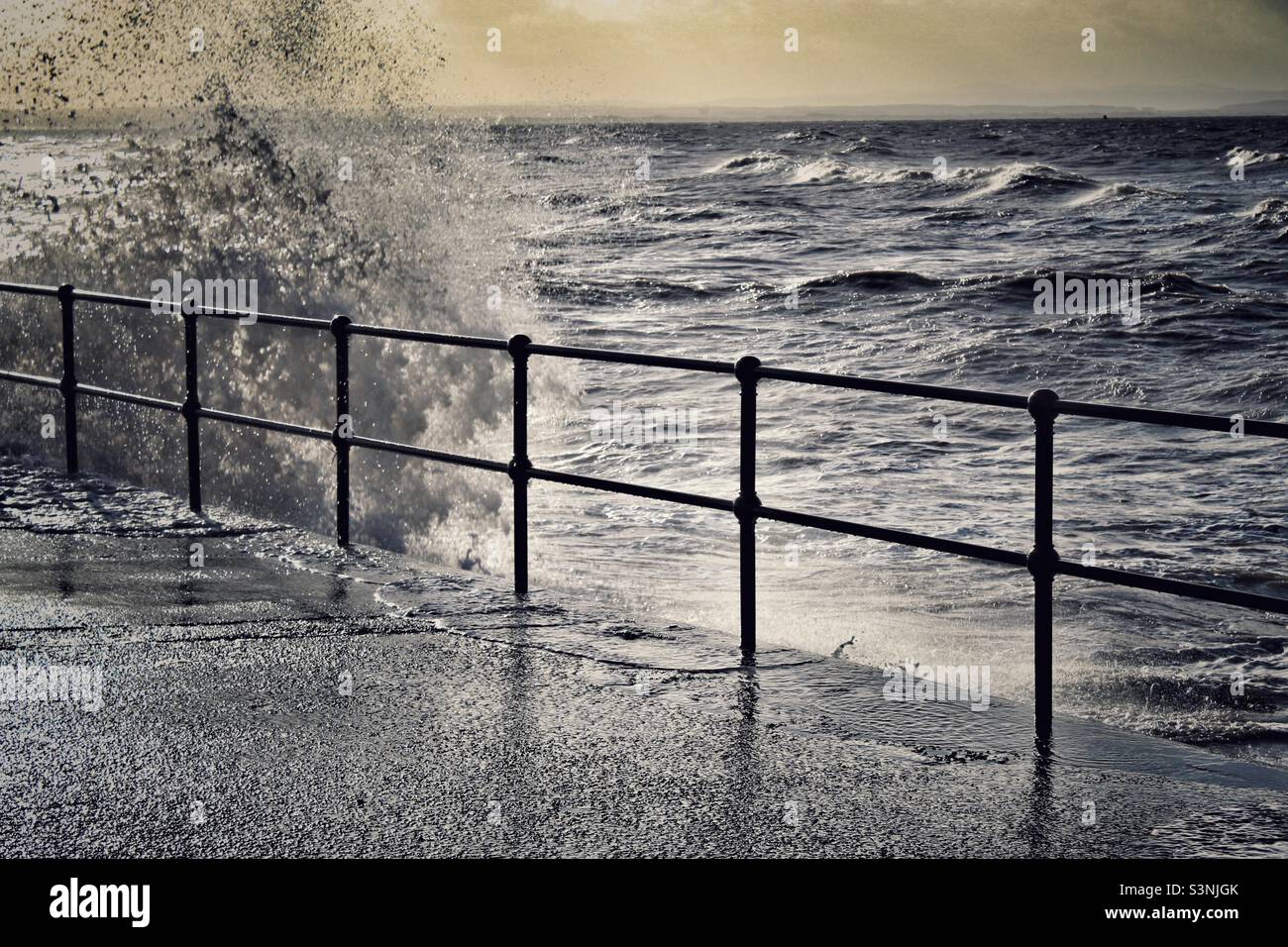 Sea crashing against the coast during Storm Eunice at Crosby Beach in Liverpool, Merseyside - Smartphone Captured Stock Image
