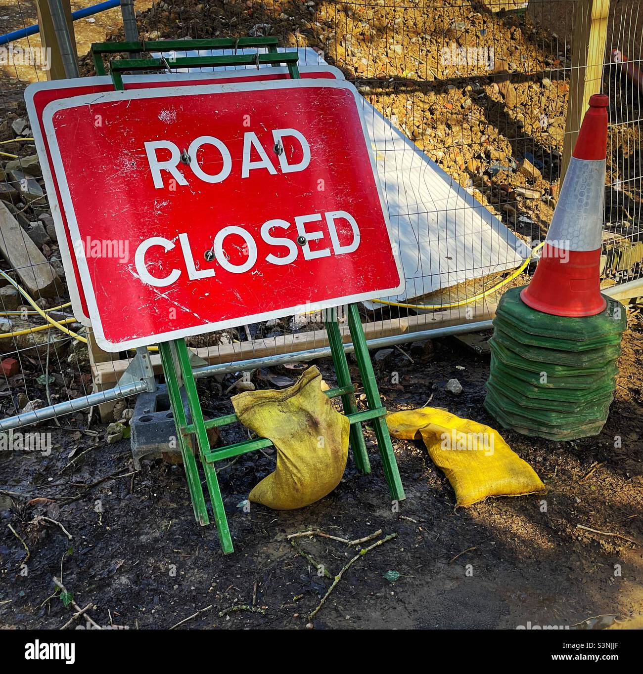 ‘Closing soon…’ Road Closed signs and traffic cones are stacked up