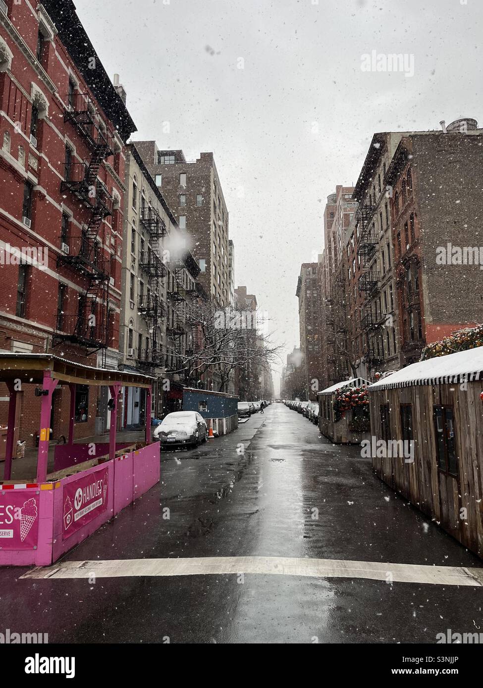 snow and a chelsea, new york street Stock Photo