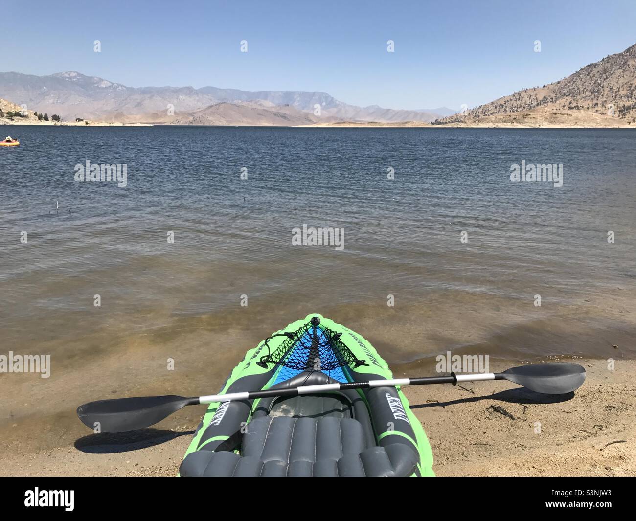 Empty kayak on beach of a lake in California Stock Photo