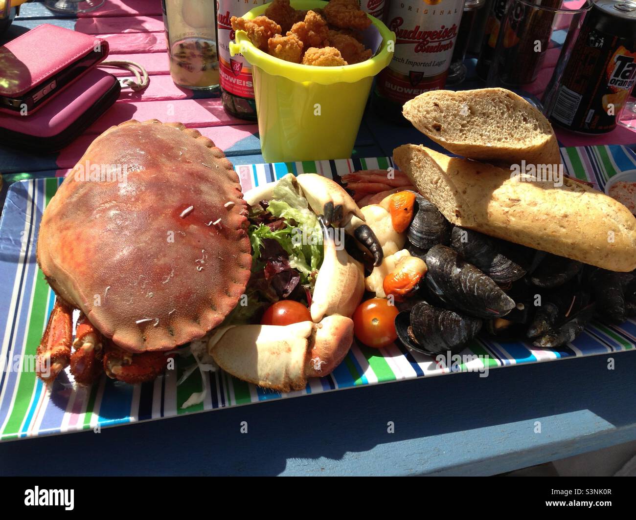 Full crab lunch at the seaside, with a bucket of chips Stock Photo Alamy