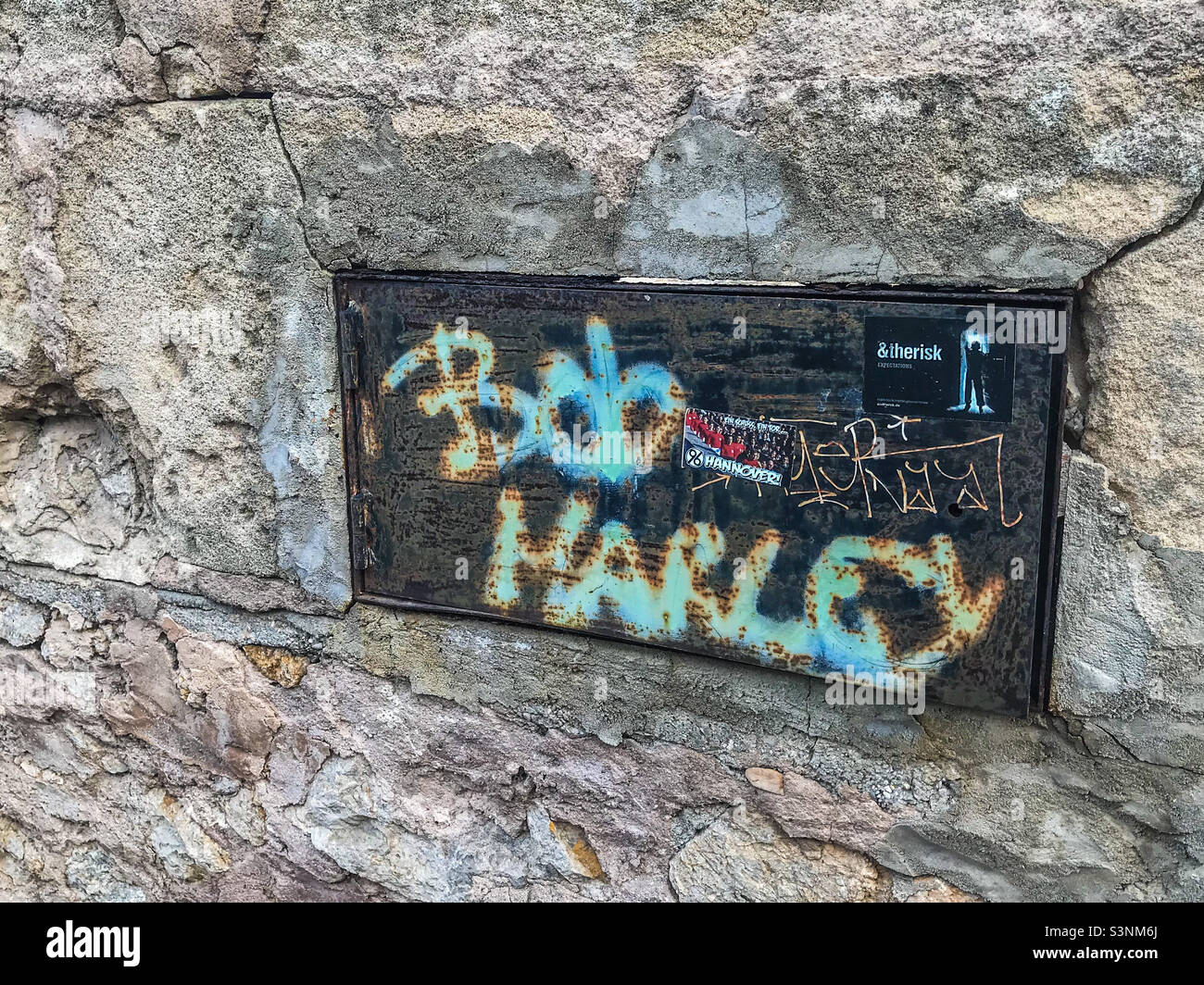 Bob Marley graffiti on a street plaque - Smartphone Captured Stock Image