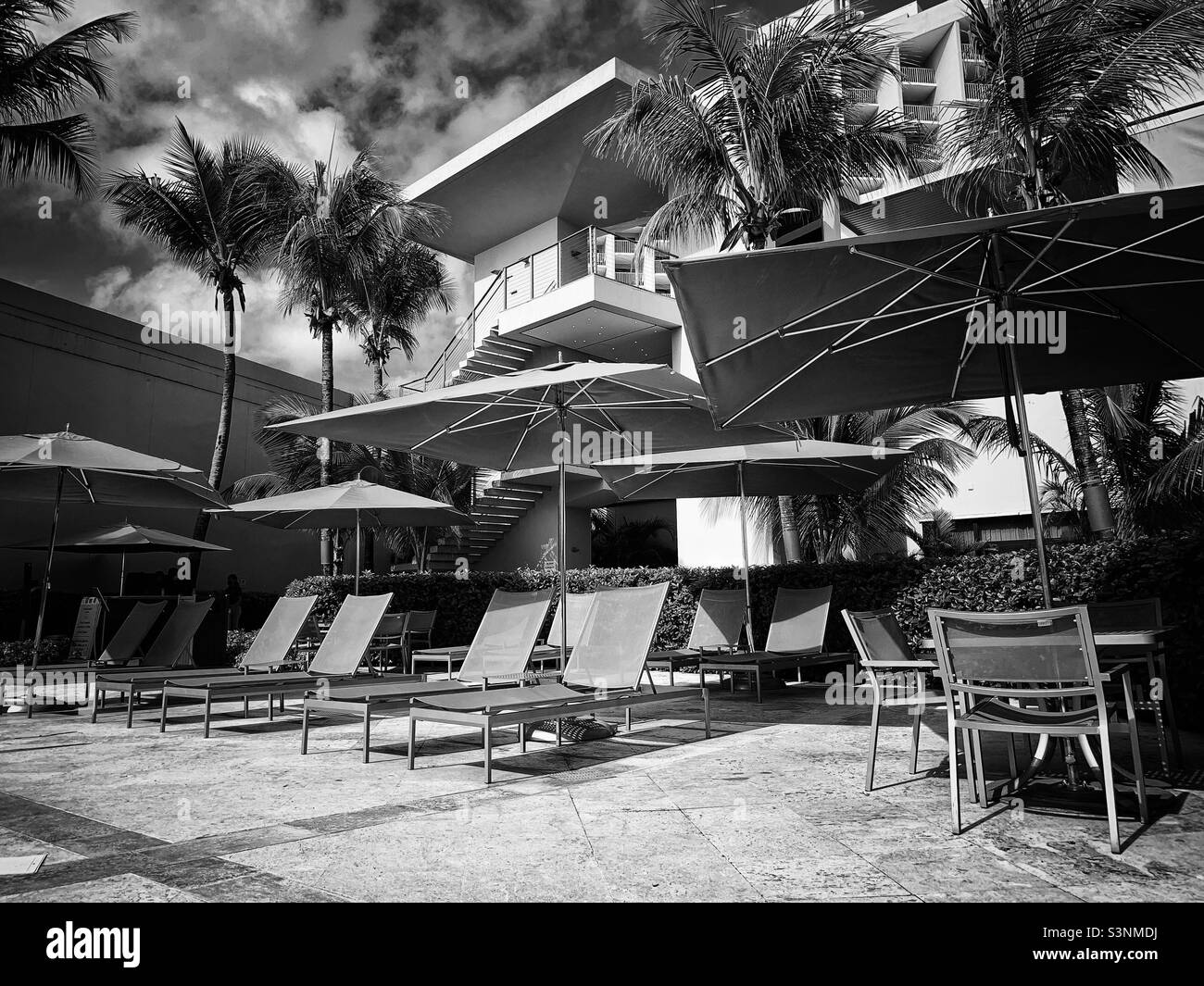 Lounger chairs courtyard by Marriott Isla Verde Puerto Rico. Black and white. - Smartphone Captured Stock Image