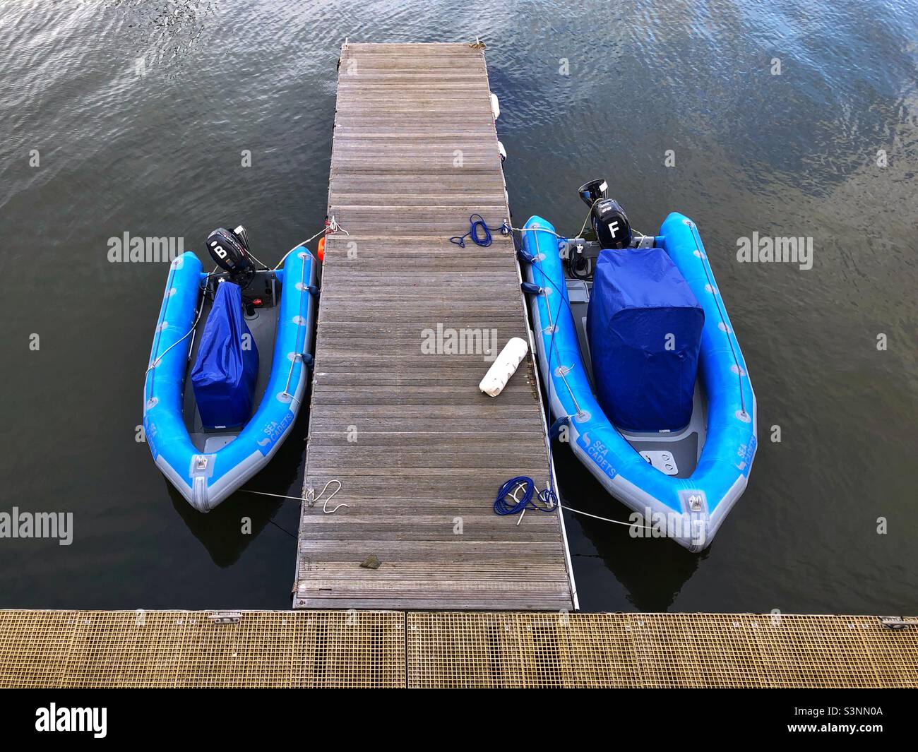 Inflatable Outboard motor boats moored in harbour - Smartphone Captured Stock Image