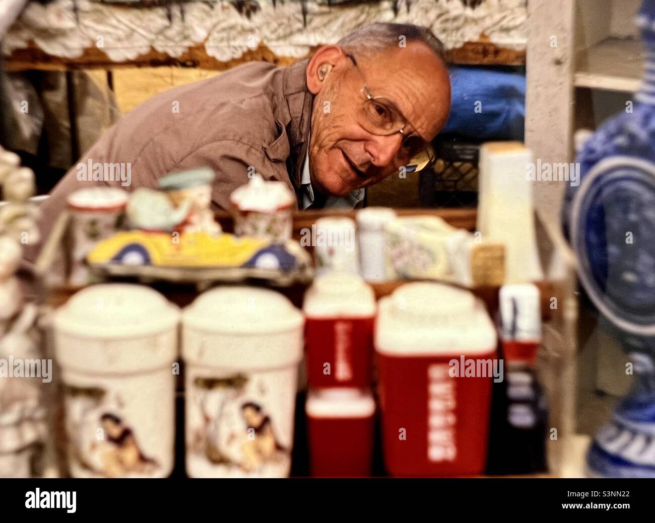 Shopkeeper man behind counter at Independent shop in Berkshires Region of Massachusetts Stock Photo