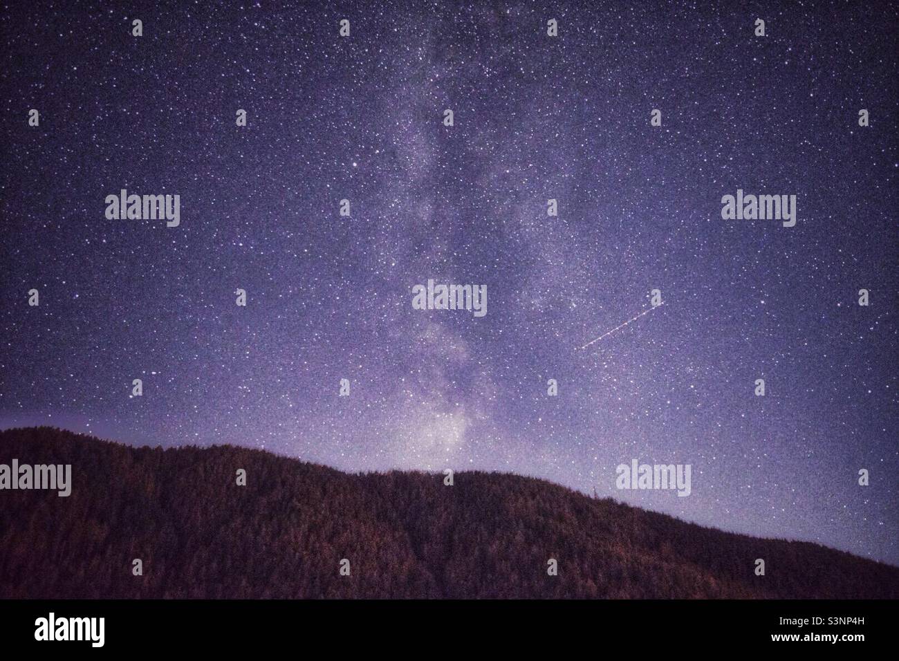 Milky way over the hill in South Tyrol, Italy - Smartphone Captured Stock Image