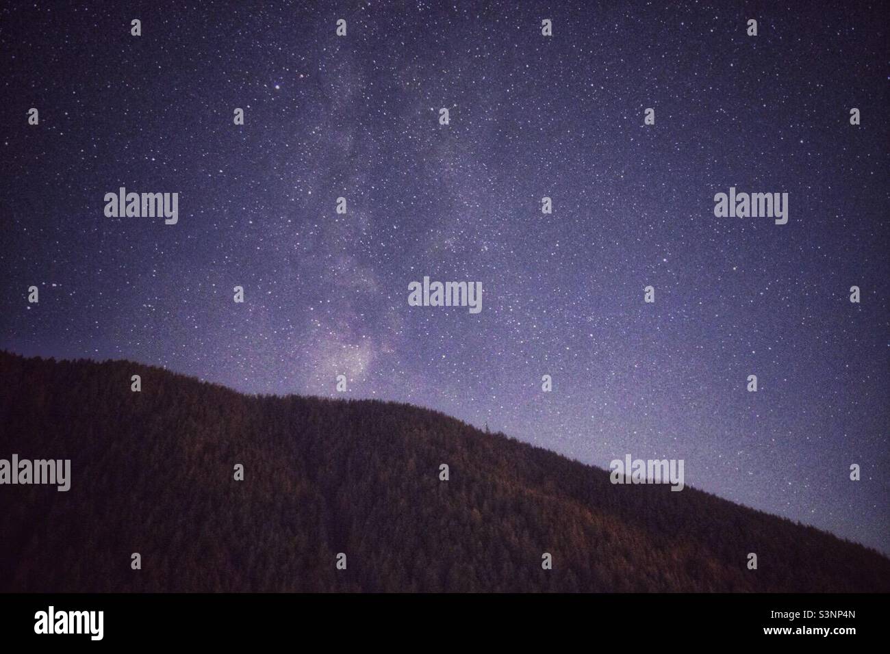 Milky way over the hill in South Tyrol, Italy - Smartphone Captured Stock Image