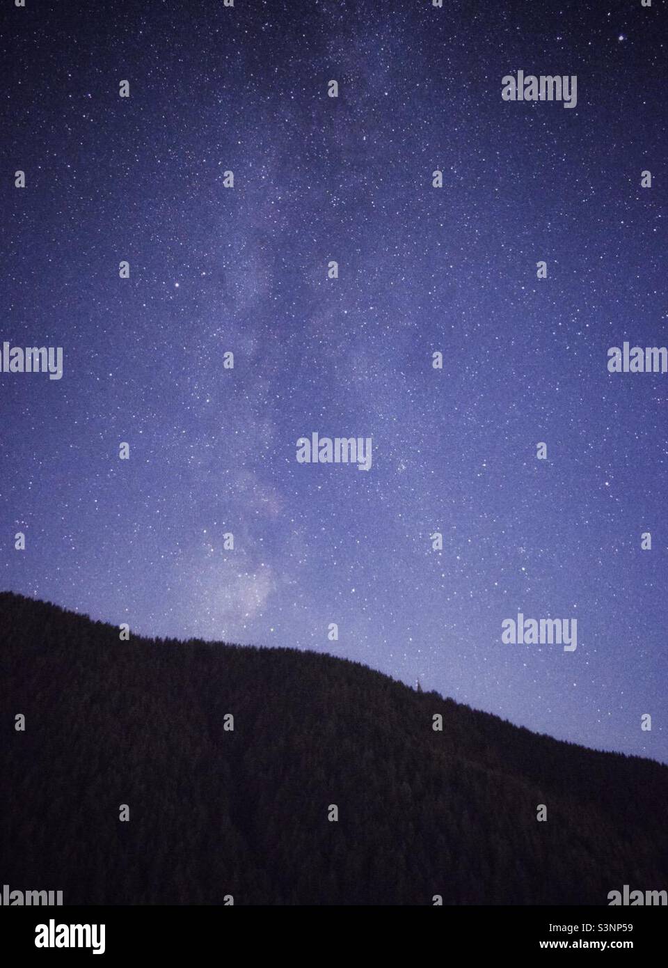Milky way over the hill in South Tyrol, Italy - Smartphone Captured Stock Image