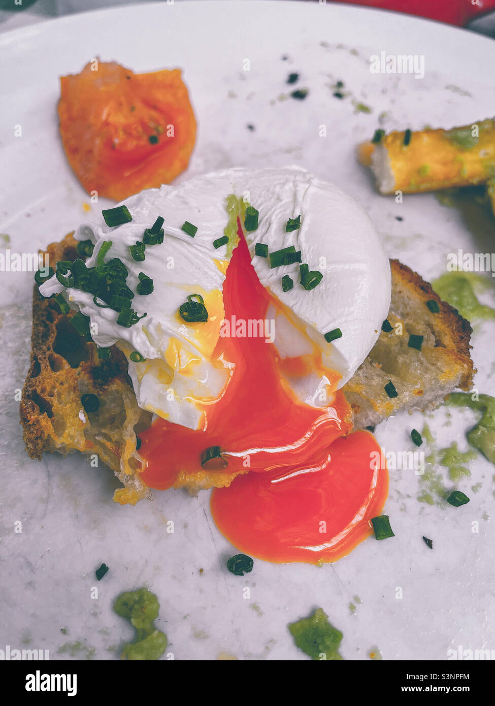 Perfect yellow poached egg - Smartphone Captured Stock Image