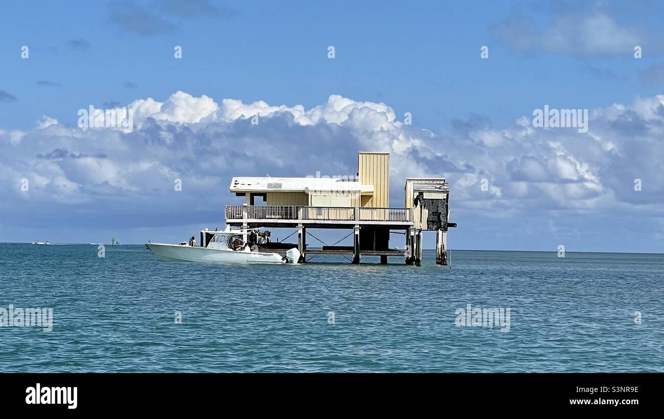 House in Stiltsville in Biscayne Bay, Miami, Florida with the Miami skyline in the background. Stock Photo