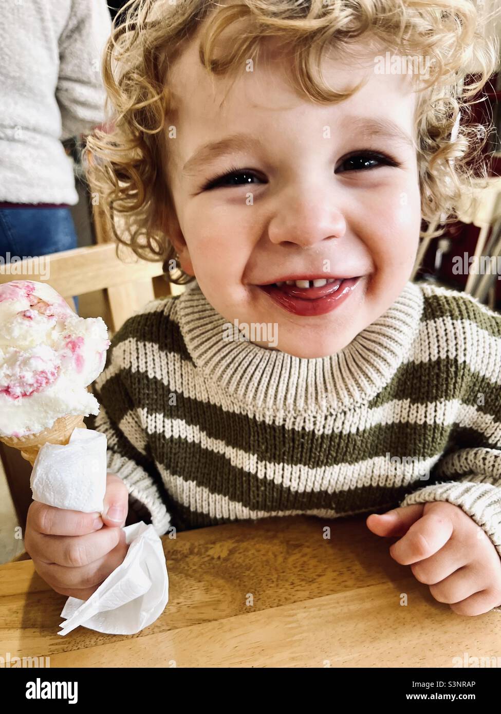 Toddler eating ice cream happy cute Stock Photo Alamy