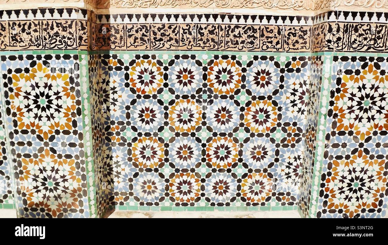 Traditional colourful tiled wall on a building in Marrakesh Stock Photo