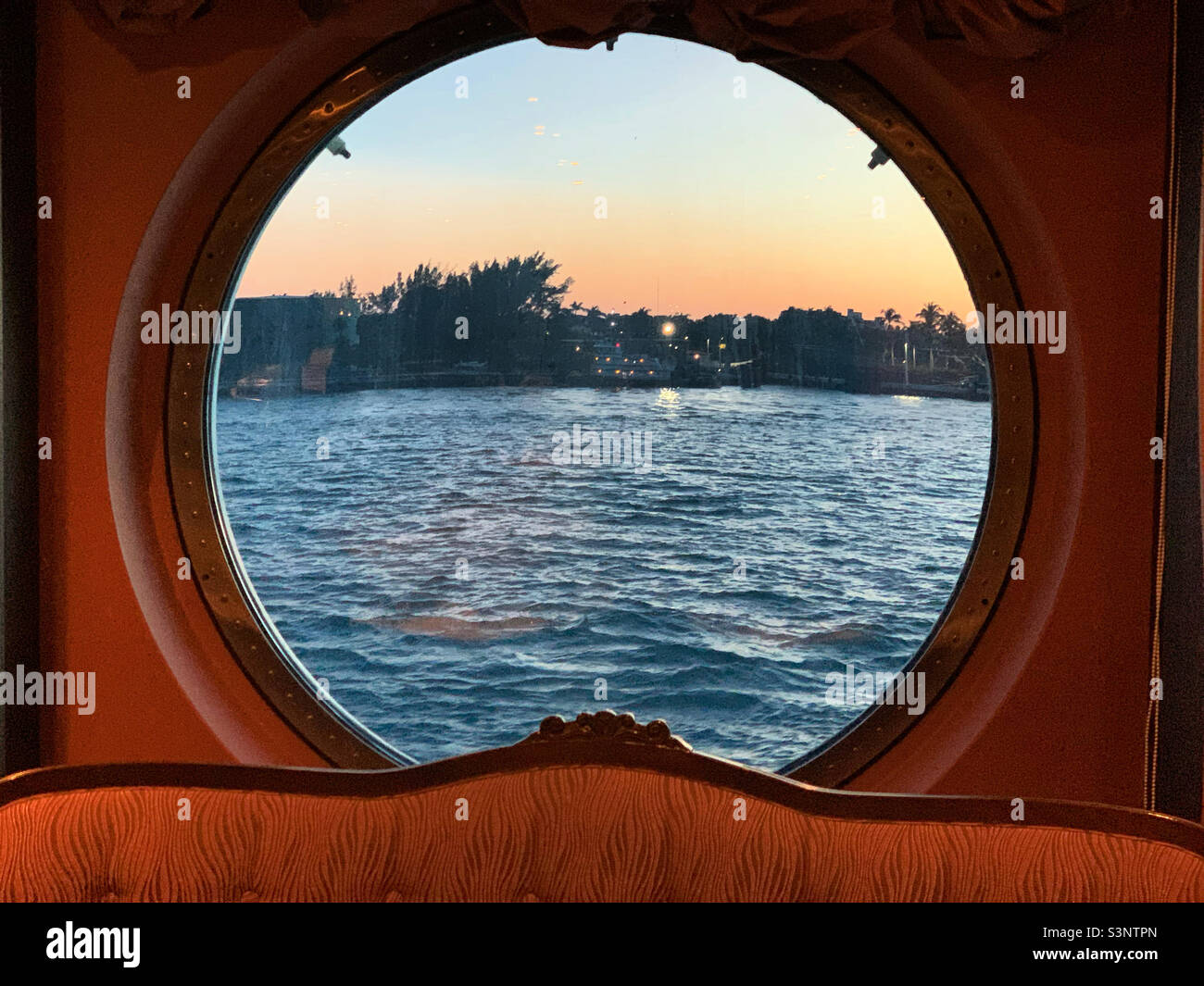 January, 2022, Porthole in the Black Crab restaurant, MSC Divina, as the ship leaves Miami, Florida, for a cruise to the Bahamas - Smartphone Captured Stock Image